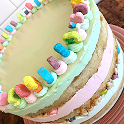 <strong>Lucky Charms Cake</strong> <br>butter cake . vanilla buttercream . sticky marshmallow syrup . white chocolate ganache . Lucky Charms