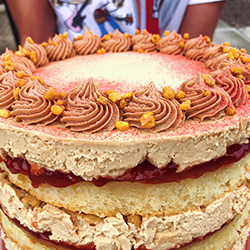 <strong>Peanut Butter & Jelly Cake</strong> <br>butter cake . peanut butter buttercream . strawberry jam . homemade peanut butter cookies . peanut brittle crunch . strawberry dust