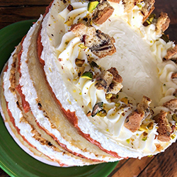 <strong>Sicilian Blood Orange Cake</strong> <br>blood orange curd . fluffy mascarpone frosting . toasted pistachios . vanilla butter cake